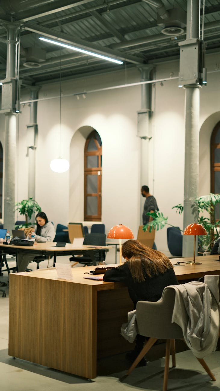 Modern coworking space in Latin American city with professionals working at standing desks