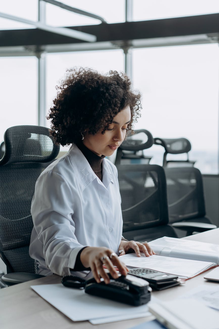 Insurance account manager on phone call at professional office desk